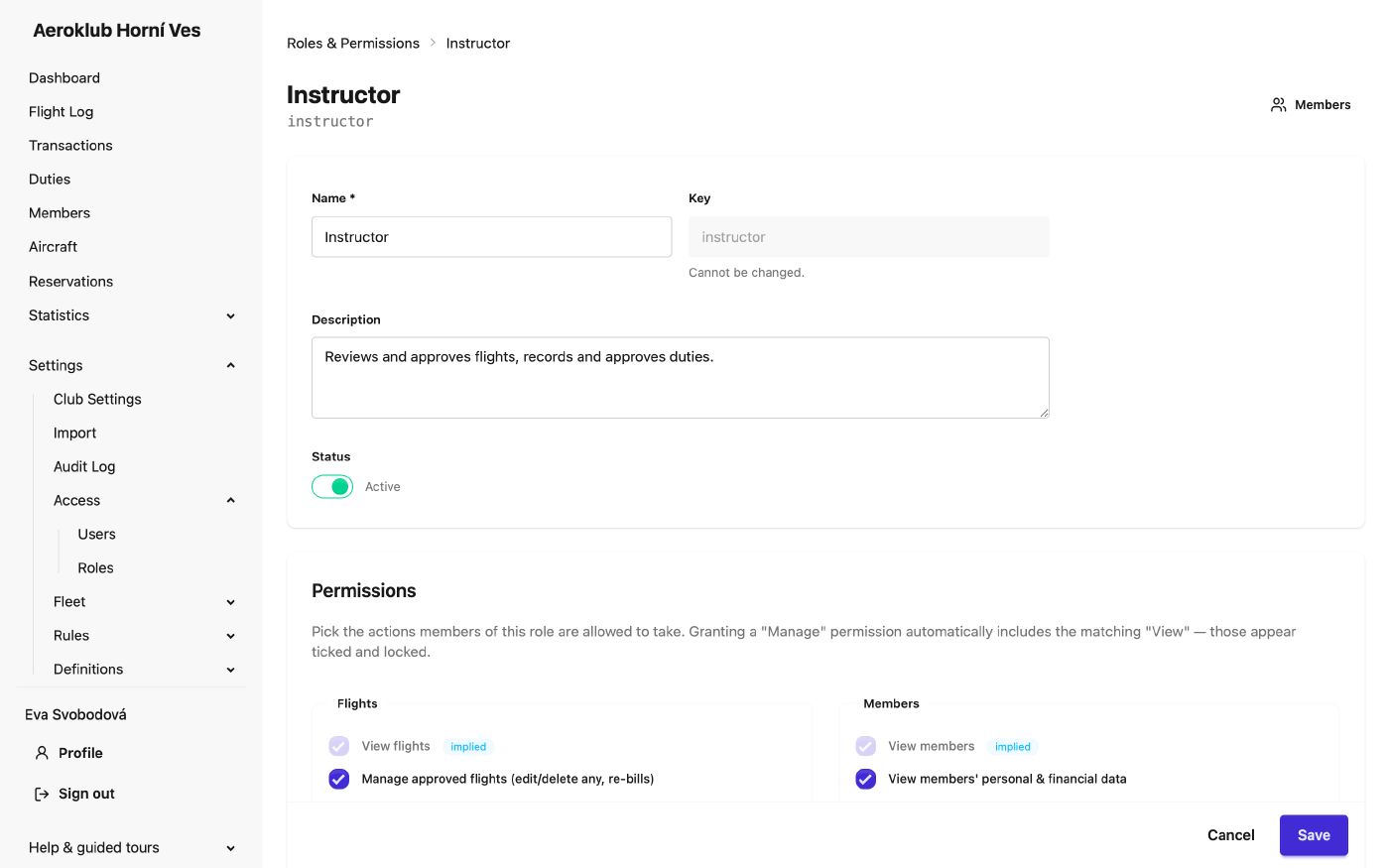 Editing a role: name, key, status and the permission matrix, where granting Manage also includes View